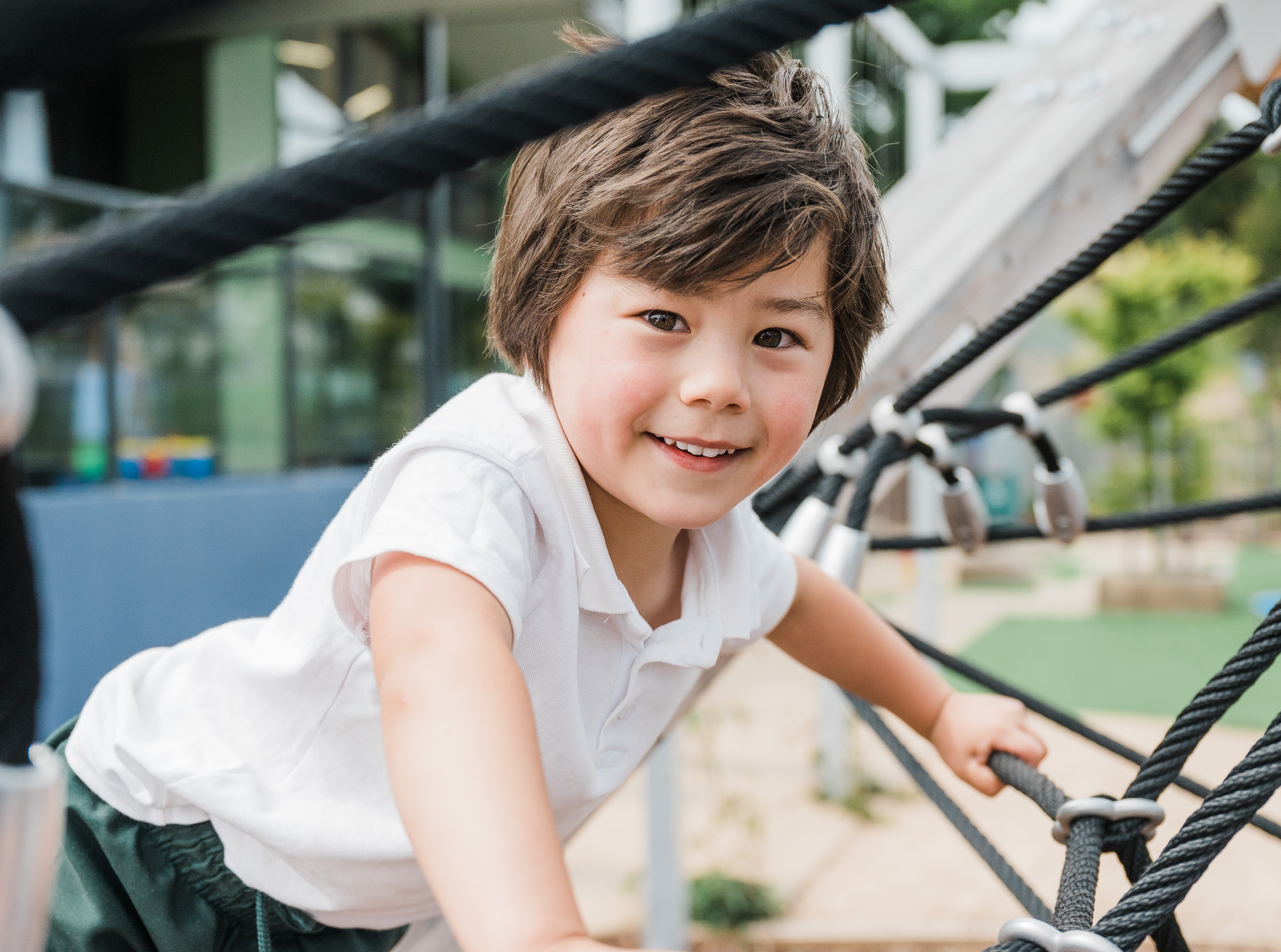 A child climbing on a playground.